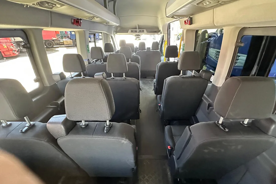 Inside the Ford Transit minibus, view down the aisle