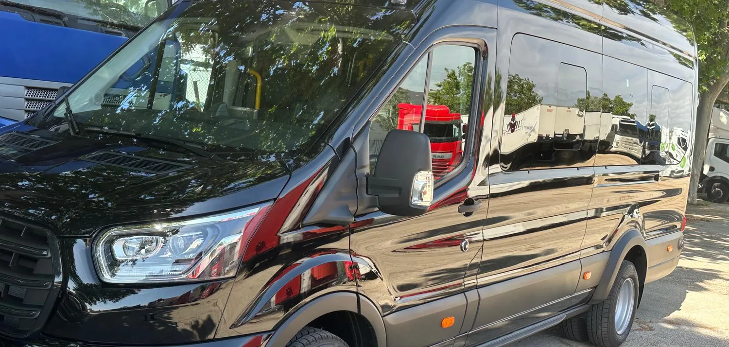 Black Ford Transit minibus parked in Barcelona