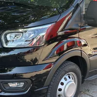 Black Ford Transit minibus