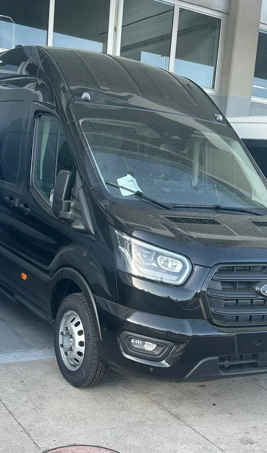 Black Ford Transit minibus