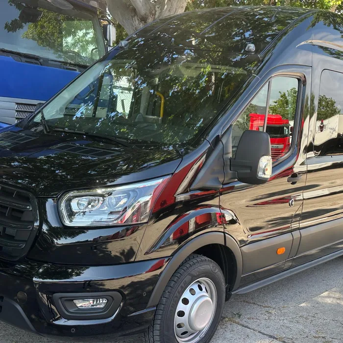 Black Ford Transit minibus