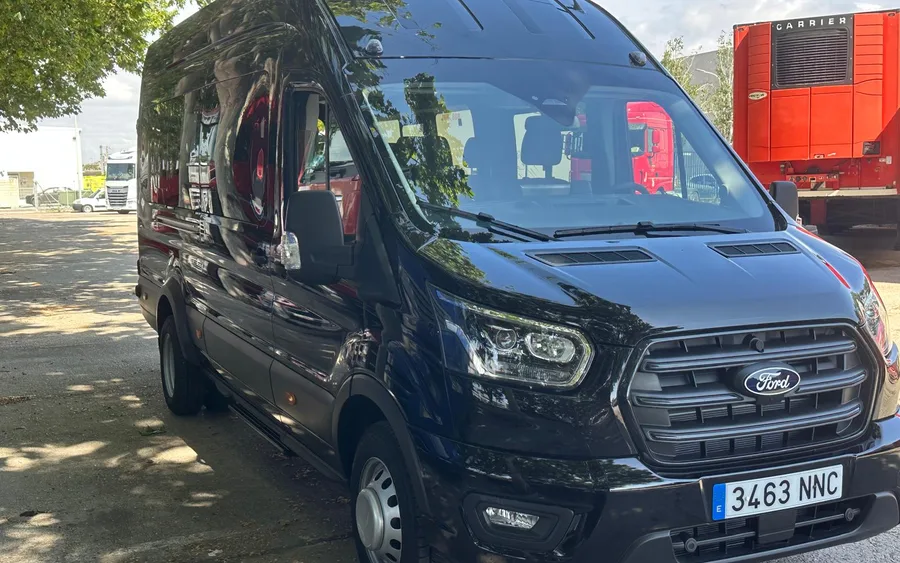 Black Ford Transit minibus