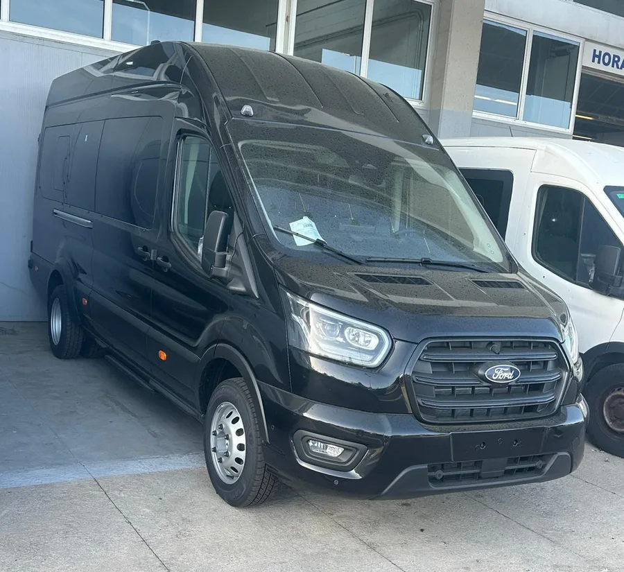 Black Ford Transit minibus